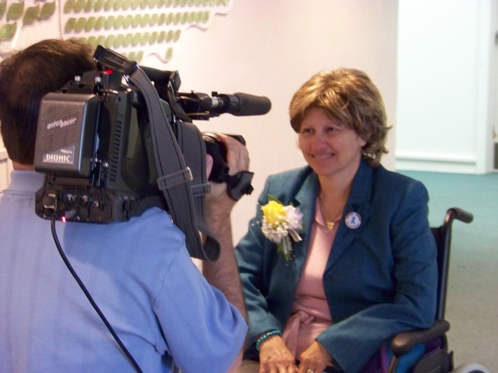 Carol Greenberg being interviewed about Cancer Answers Health Fair.jpg